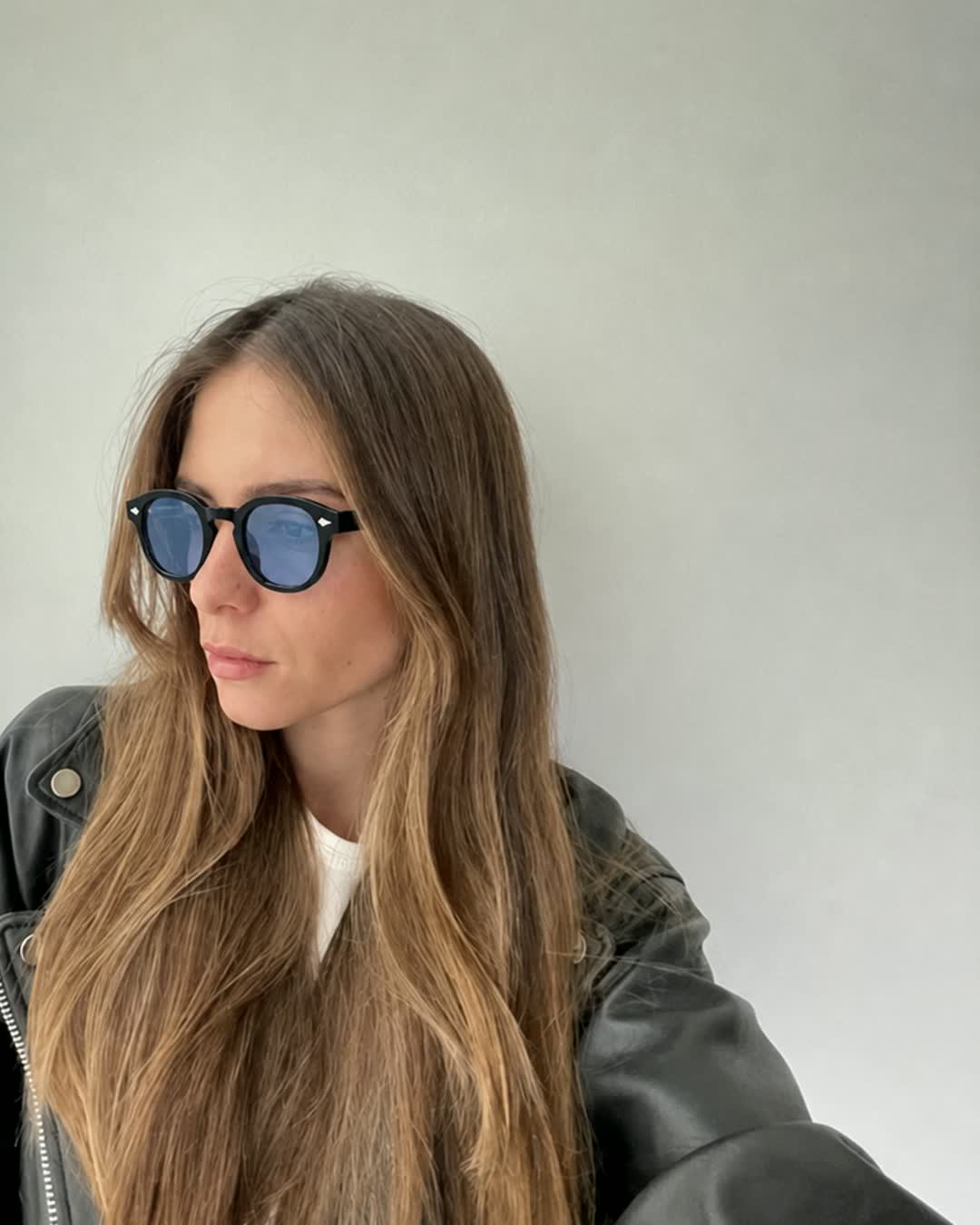 Woman wearing Aura Eyes blue-tinted round sunglasses